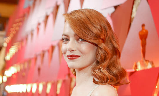 Emma Stone at the Oscars in gold dress